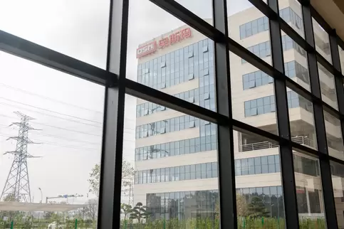 Actual photo of the Osm Comprehensive Building window view: Modern architecture blends with the urban landscape, showcasing Osma's headquarters strength in the high-end equipment manufacturing sector and its image as an urban industrial landmark.