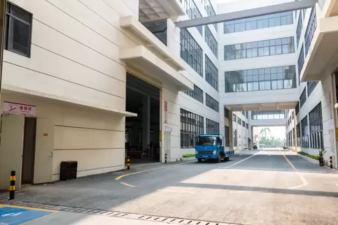 Another view of the internal roads within the Osm Intelligent Equipment Manufacturing Park, showcasing the modern intelligent logistics channels and their depth of landscape. The design seamlessly blends industrial aesthetics with ecological principles, h