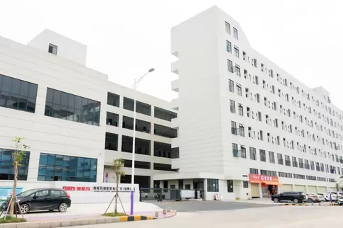 Panoramic view of the northeast side gate of the Osm Intelligent Equipment Production Campus, featuring a modern intelligent campus entrance design that combines industrial aesthetics with safety functions, showcasing the image of a high-end manufacturing