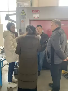 Osm Hydraulic CNC Press Brake Customer Site Footage: A professional team operates an intelligent CNC system to perform high-precision sheet metal processing. The equipment utilizes hydraulic synchronization technology and a rigid machine body design to ac