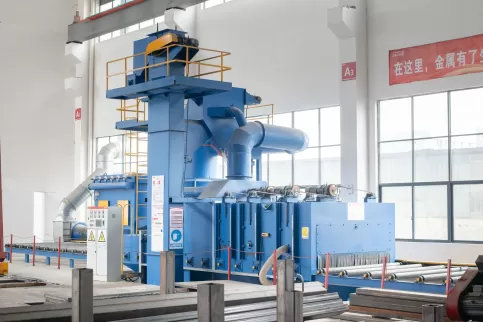 OSM bending machine automated shot blasting process close-up, showcasing high-speed steel grit impacting metal sheets for surface enhancement, enhancing component fatigue resistance and corrosion protection through precision abrasive treatment in advanced