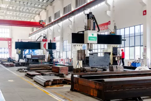 A panoramic view of OSM's professional bending machine machining workshop, showcasing precision CNC machining centers and standardized work processes. A professional team collaborates to operate high-precision machine tools, employing a strict quality con