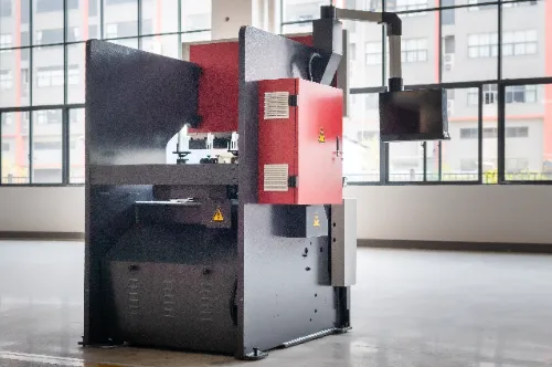 Close-up right rear view of OSM OG-50III under-actuated hydraulic CNC press brake, highlighting machine details and control interface.