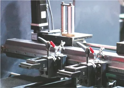 Close-up of OSM press brake semi-automatic backgauge assembly, showcasing precise control and efficient bending performance.