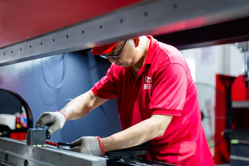 OSM technician conducting rigorous quality inspection on CNC equipment to ensure consistent and reliable product performance.