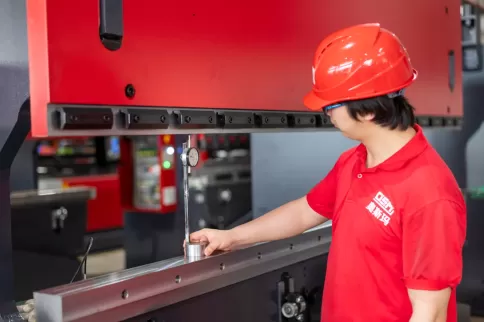OSM technician performing precision testing to ensure high-accuracy performance of the press brake during production.