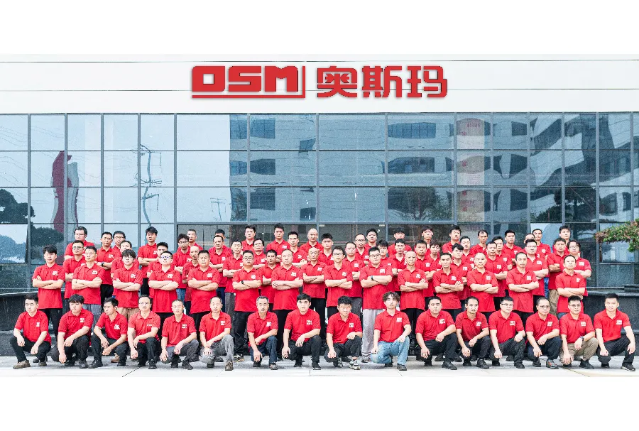 Group photo of OSMA's service team, showcasing key members and reflecting the company's expertise and collaborative spirit in the hydraulic CNC press brake industry.