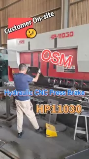 On-site demonstration of the OSM HP11030 Hydraulic CNC Press Brake. Watch a technician operate this heavy-duty industrial bending machine, showcasing its precision and capability for metal fabrication tasks.
